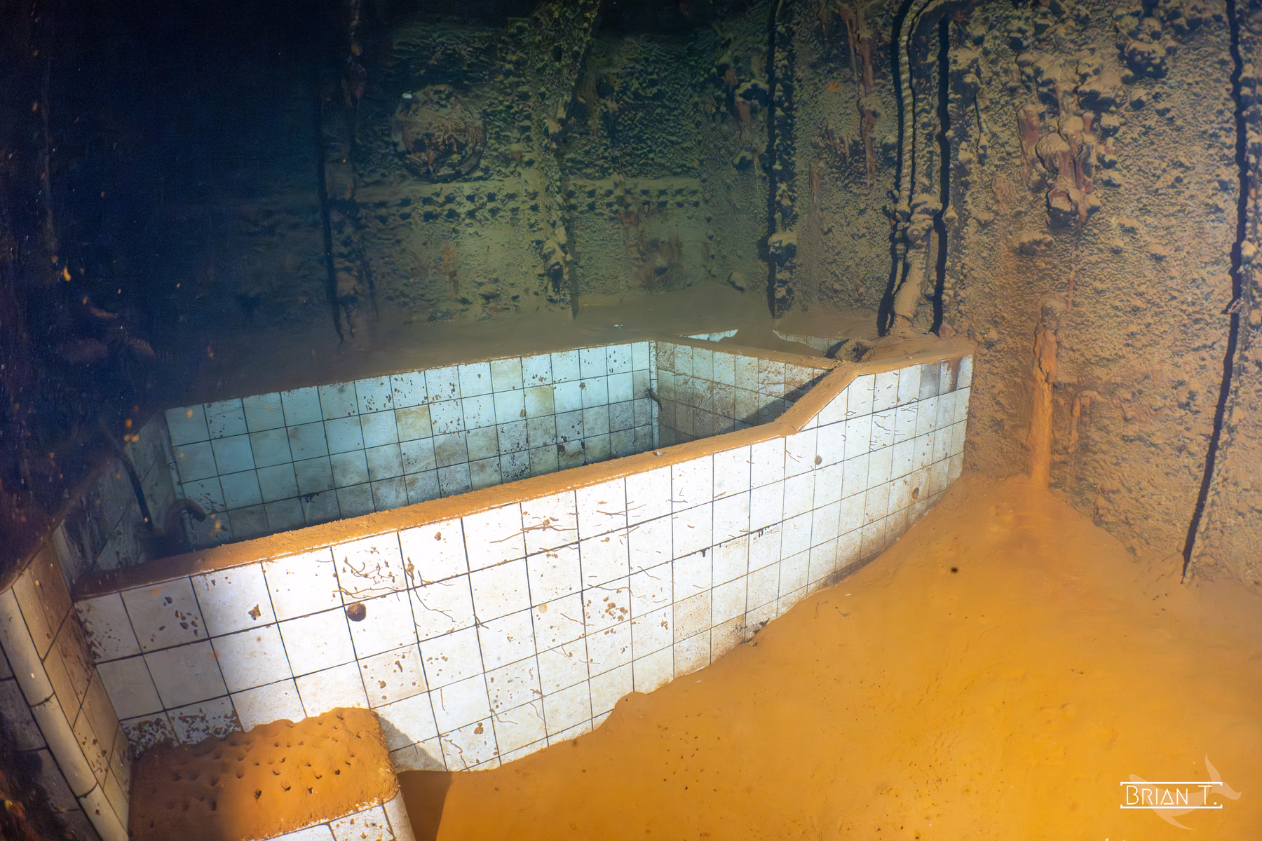 A tiled bathtub still intact inside a Truk Lagoon shipwreck